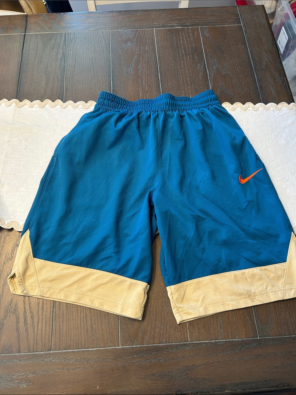 Nike Teal Athletic Shorts with Tan Hem and Orange Swoosh